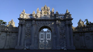 The majestic Bab Mansour gate in Meknes under a clear blue sky