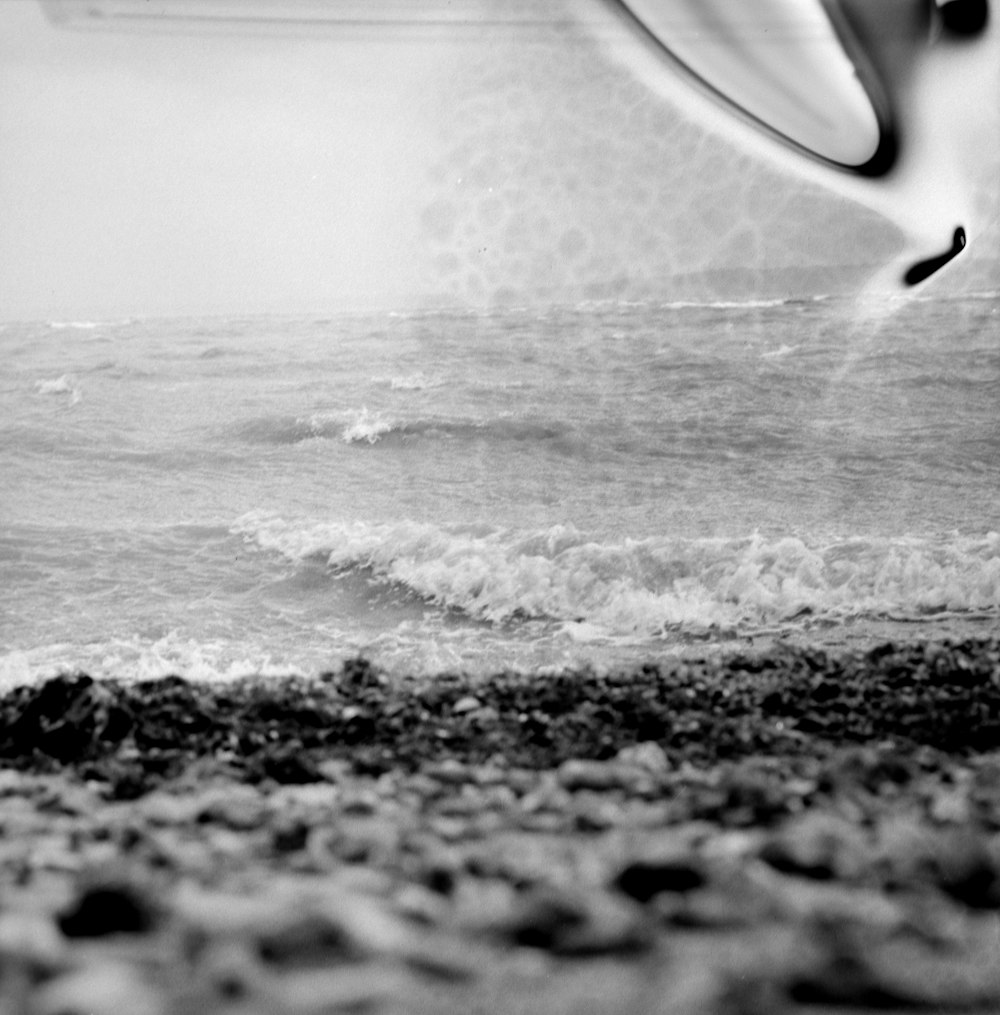 grayscale photography of body of water