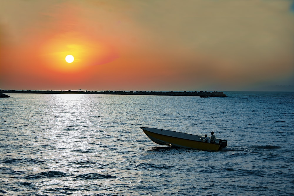 boat in sea during golden hour