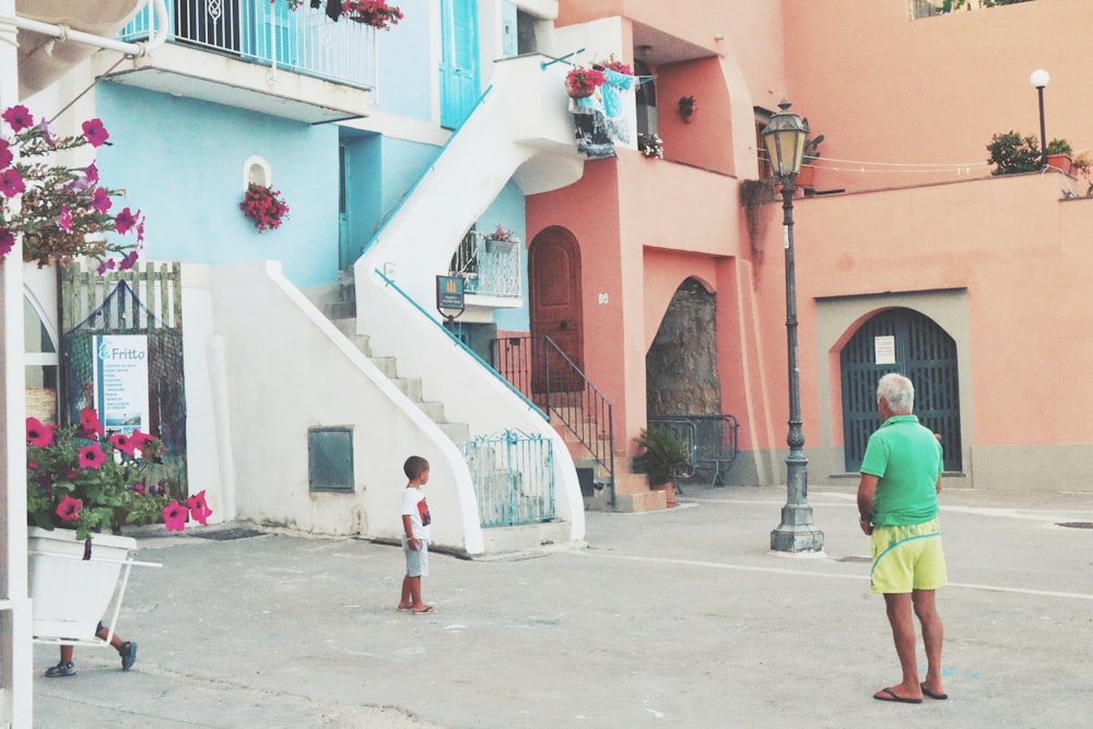 man standing beside staircase