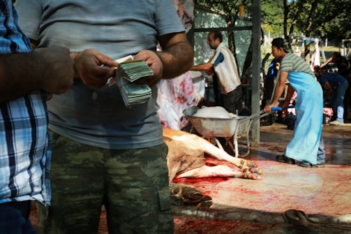 A bustling meat processing facility with workers in action.