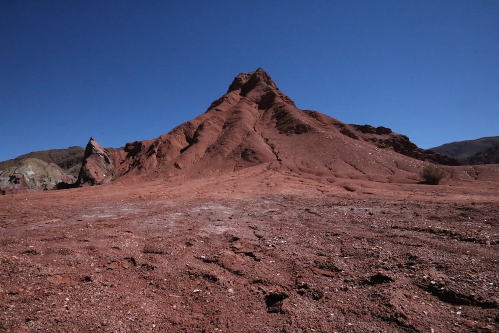 brown mountain under blue sky