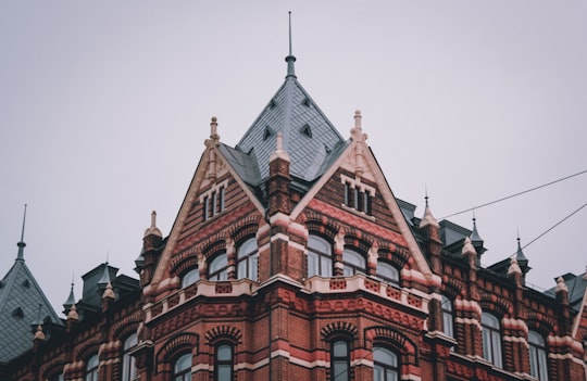 brown building under grey sky in Vasaplatsens Brygghus Sweden