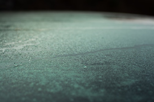 A close-up of a wet surface reflecting light beautifully.