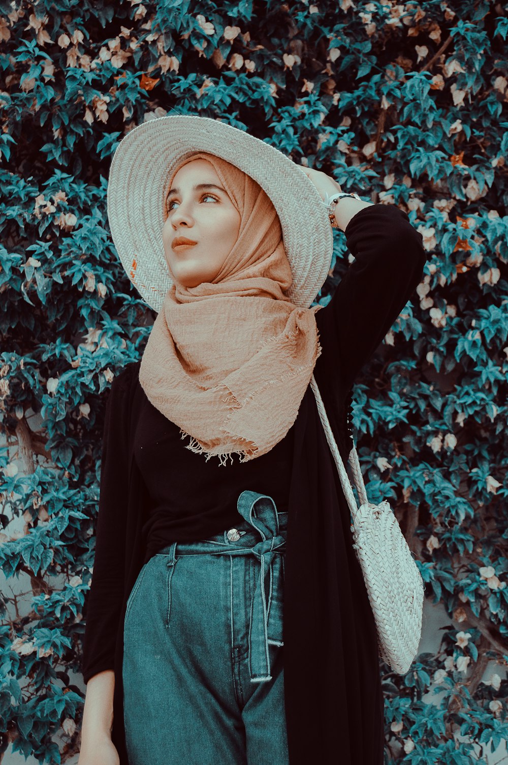 women's black open cardigan and orange hijab veil