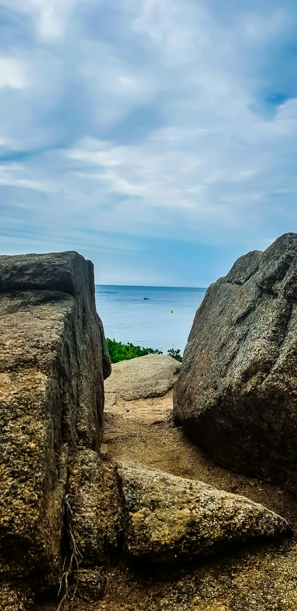 brown rocks near body of water