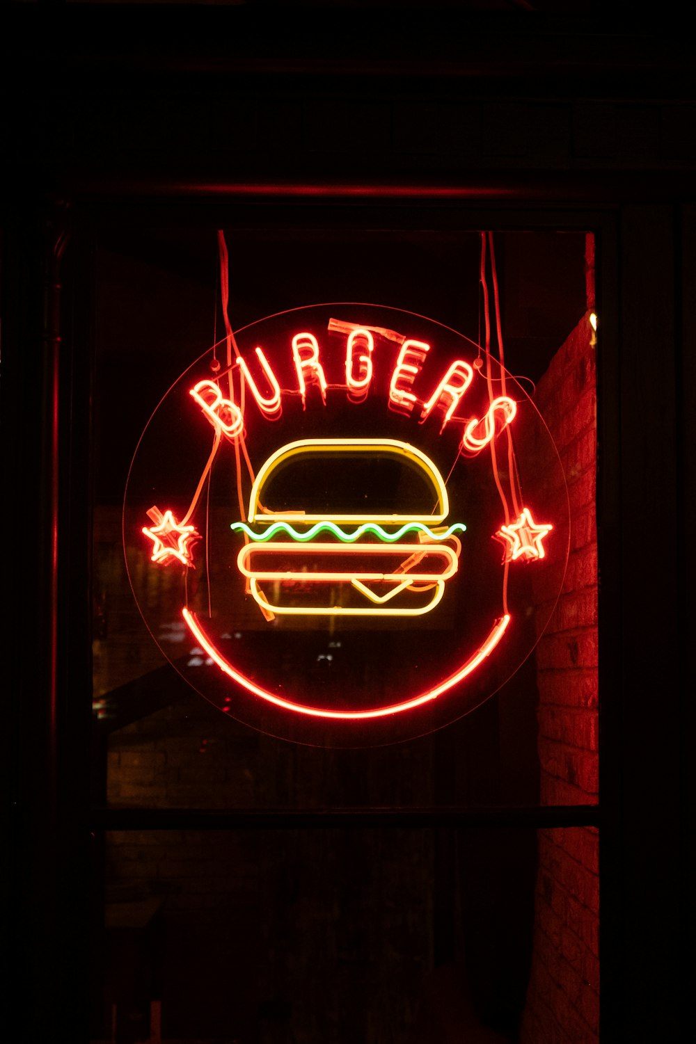red and yellow Burgers neon sign