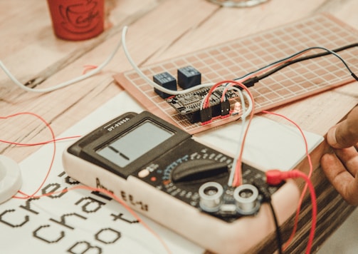 person uses white multimeter