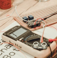 person uses white multimeter