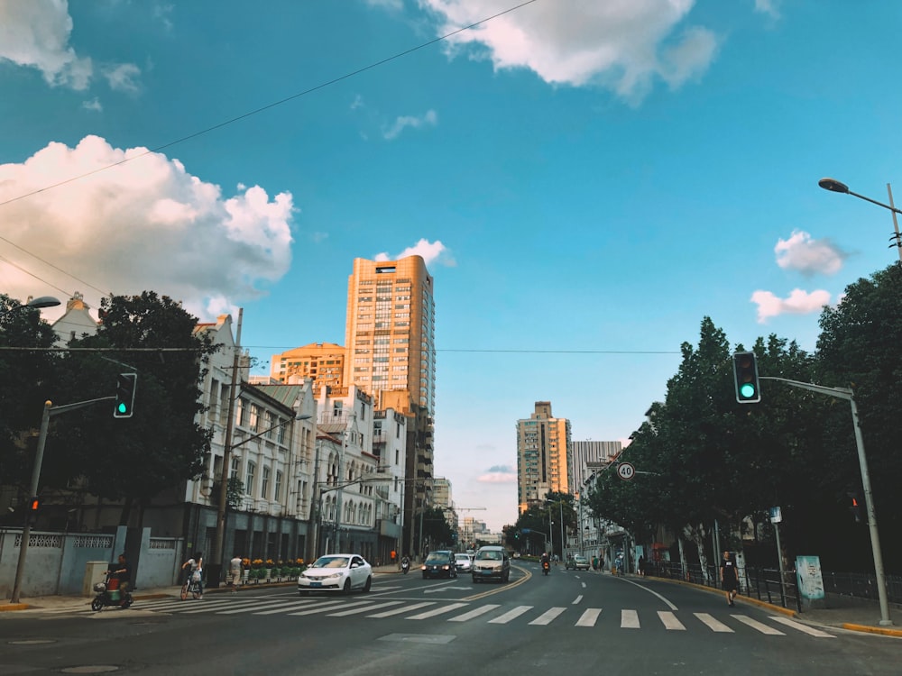 beige concrete high-rise building beside road