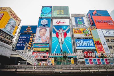 Vibrant Osaka street scene highlighting bustling urban life and elegant storefronts.