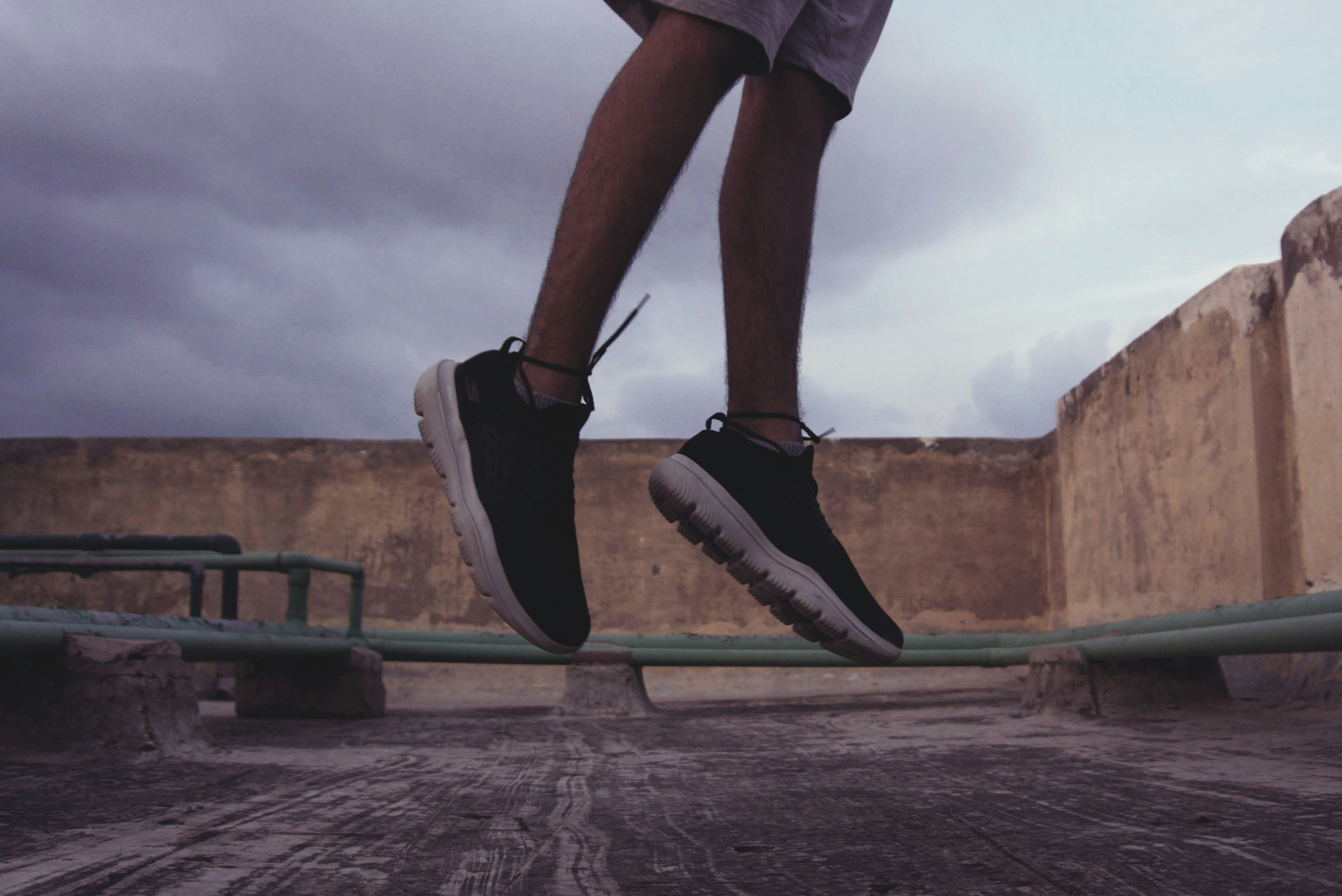 person wearing black-and-white shoes