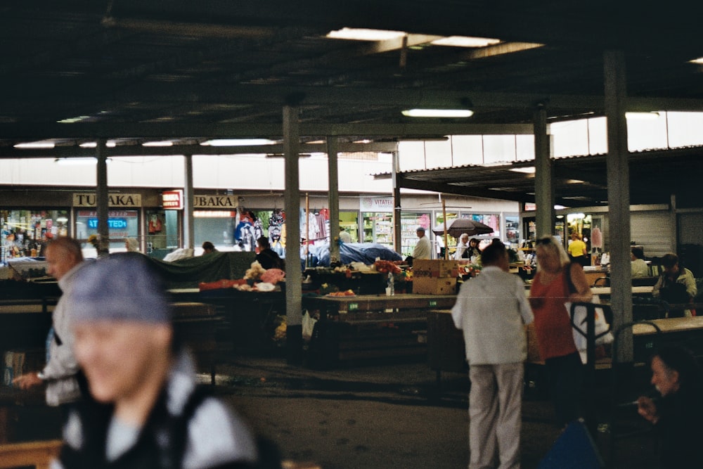 people standing near store