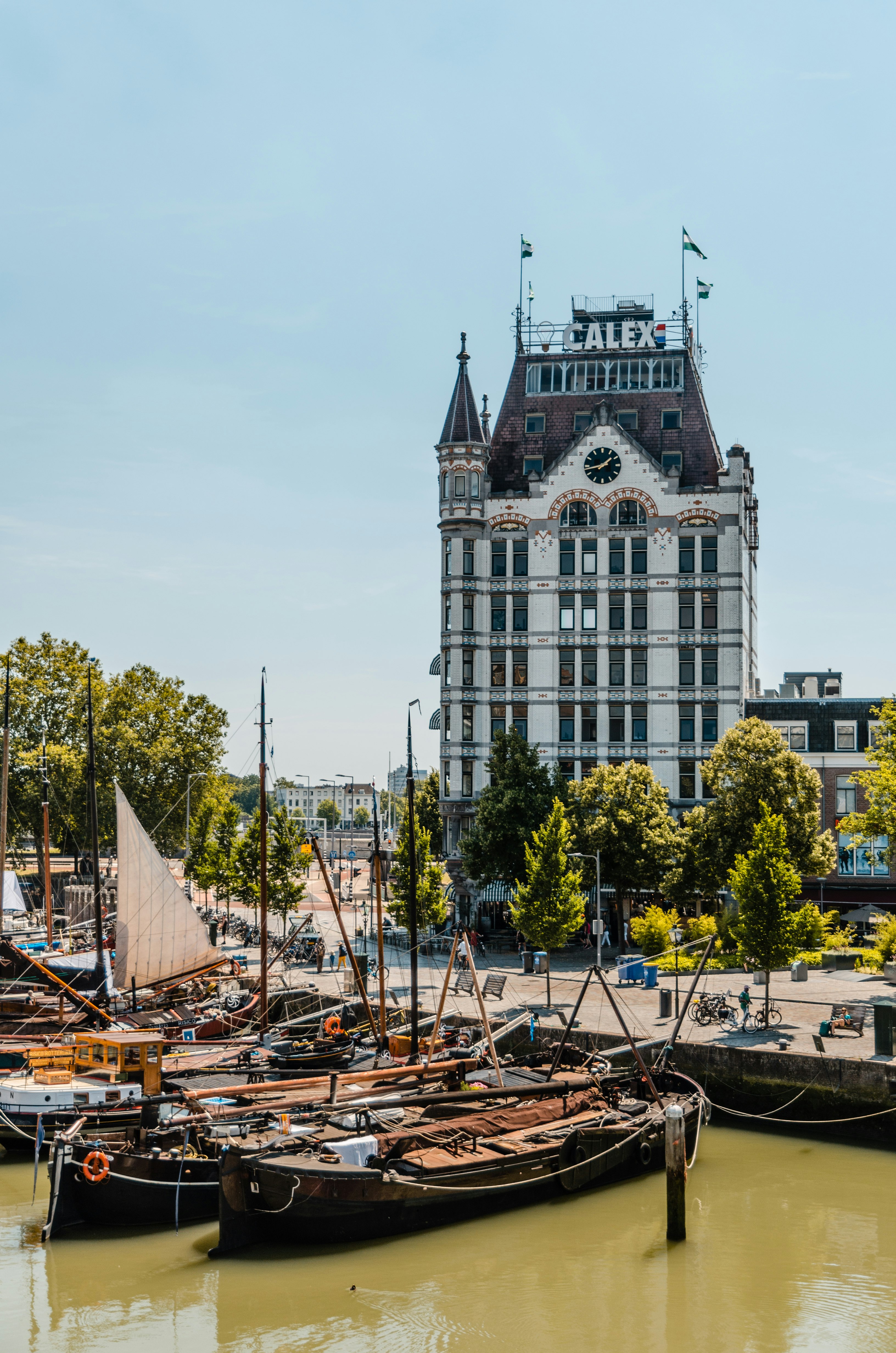 boats docked beside bay near building