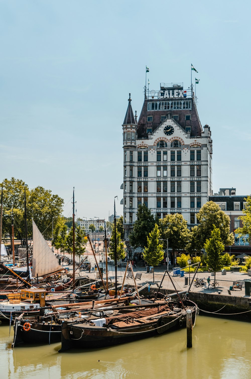 boats docked beside bay near building