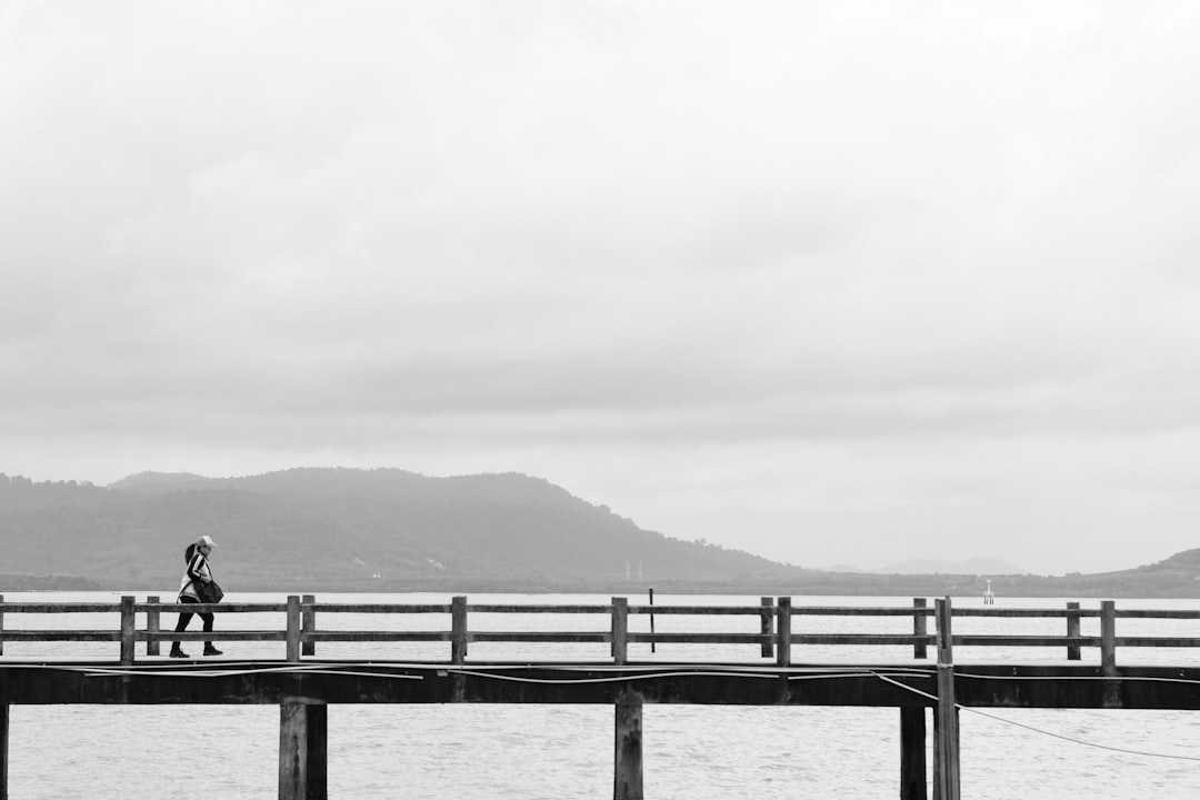 person walking on dock during daytime