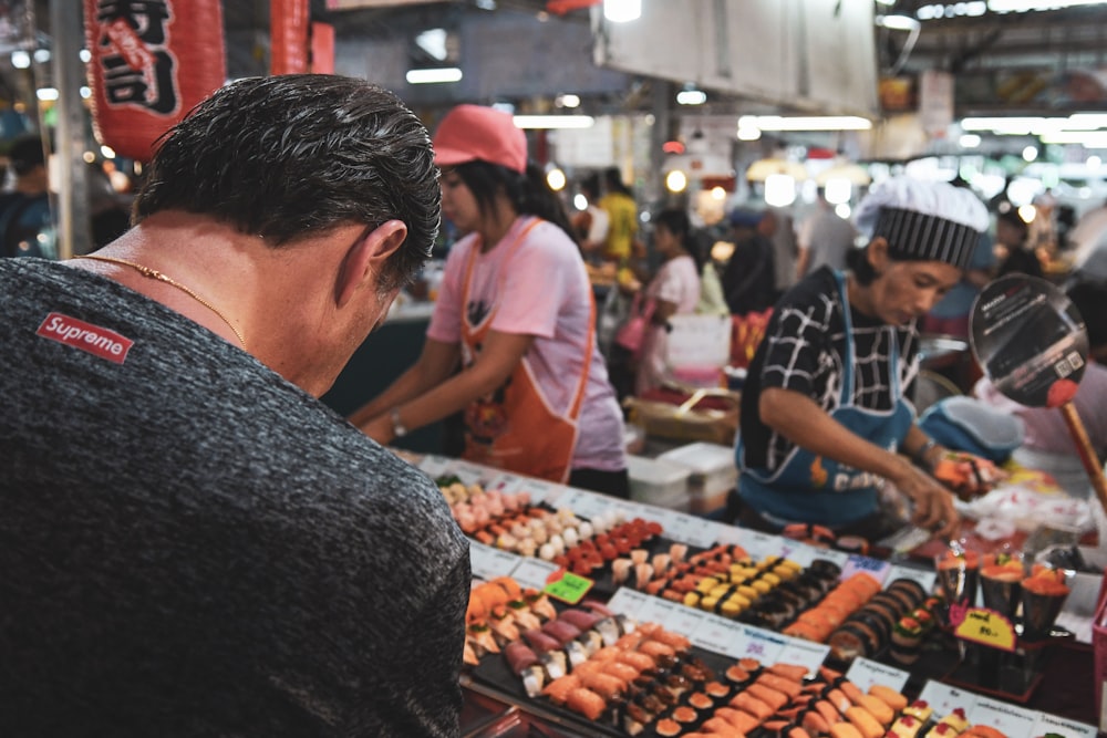 man selecting food on store