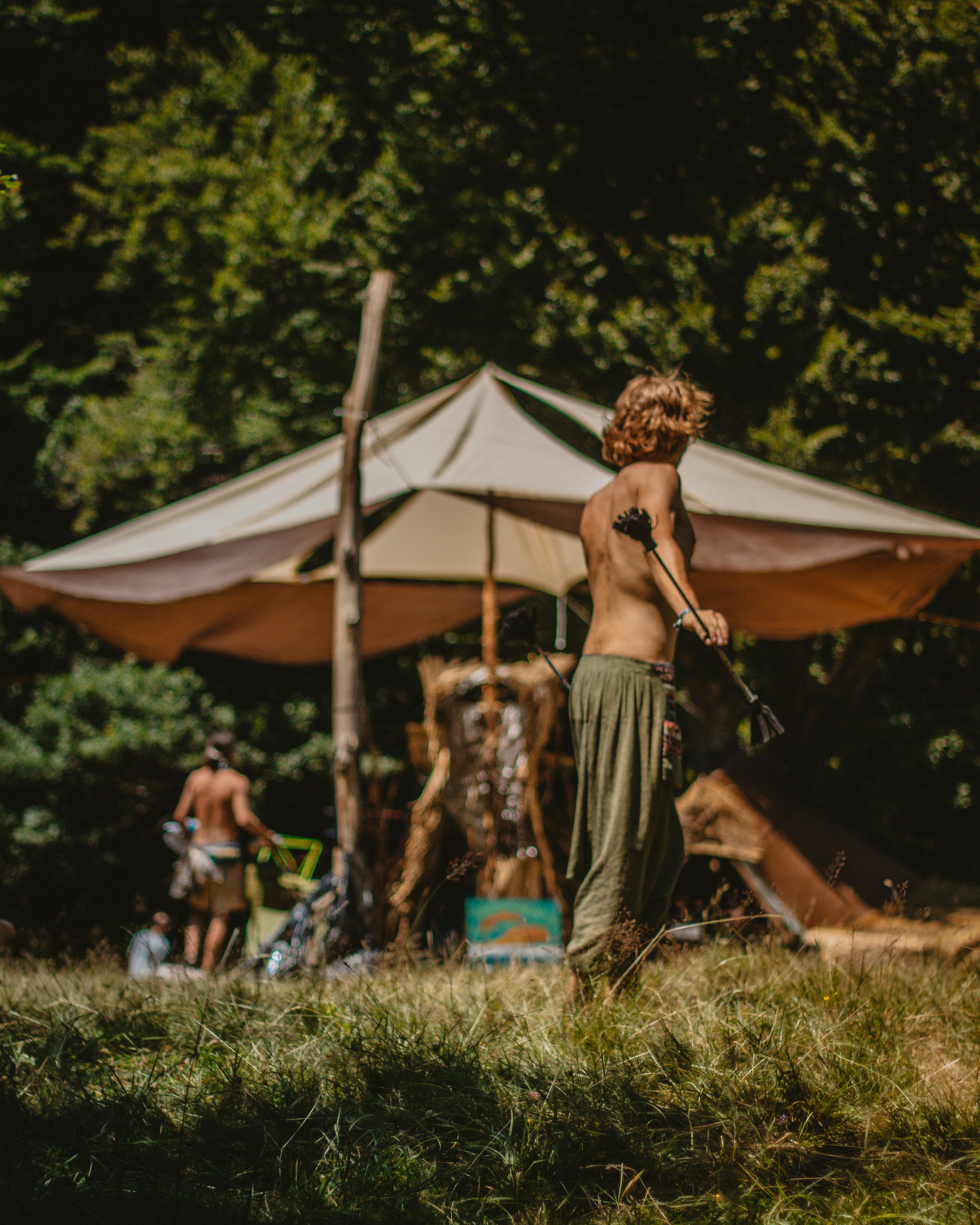 woman standing near umbrella