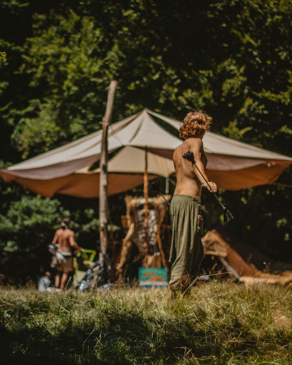 woman standing near umbrella