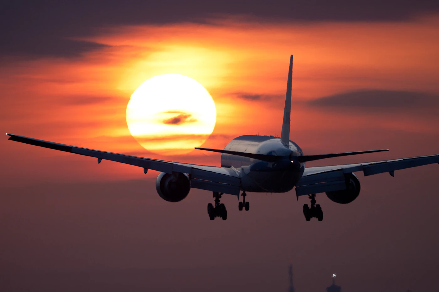 Commercial airliner cruising at golden hour