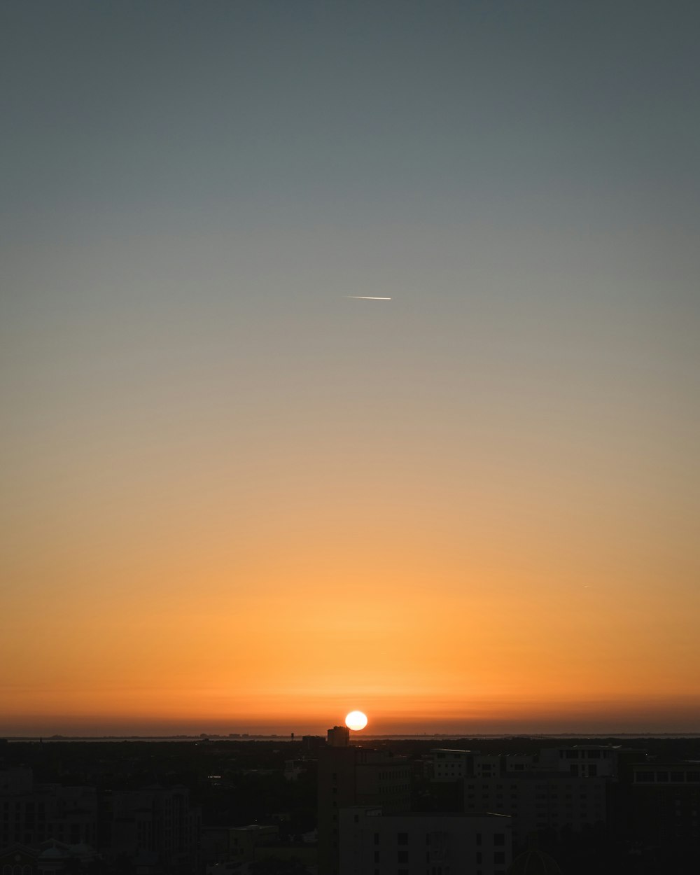 silhouette photography of buildings during sunset