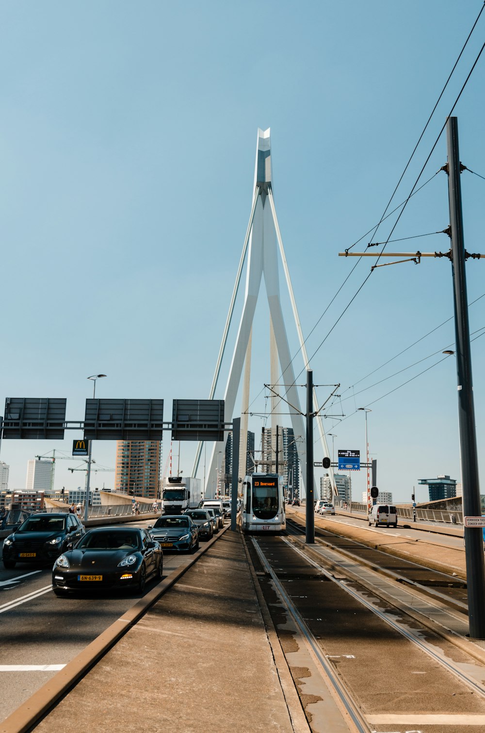 vehicles on road under clear blue sky