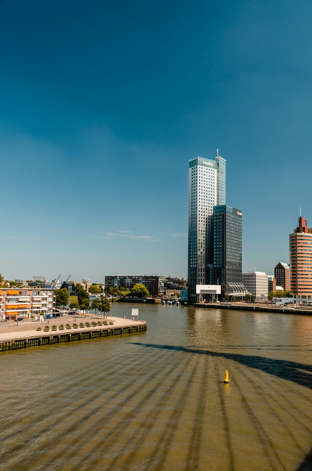 river and buildings during day