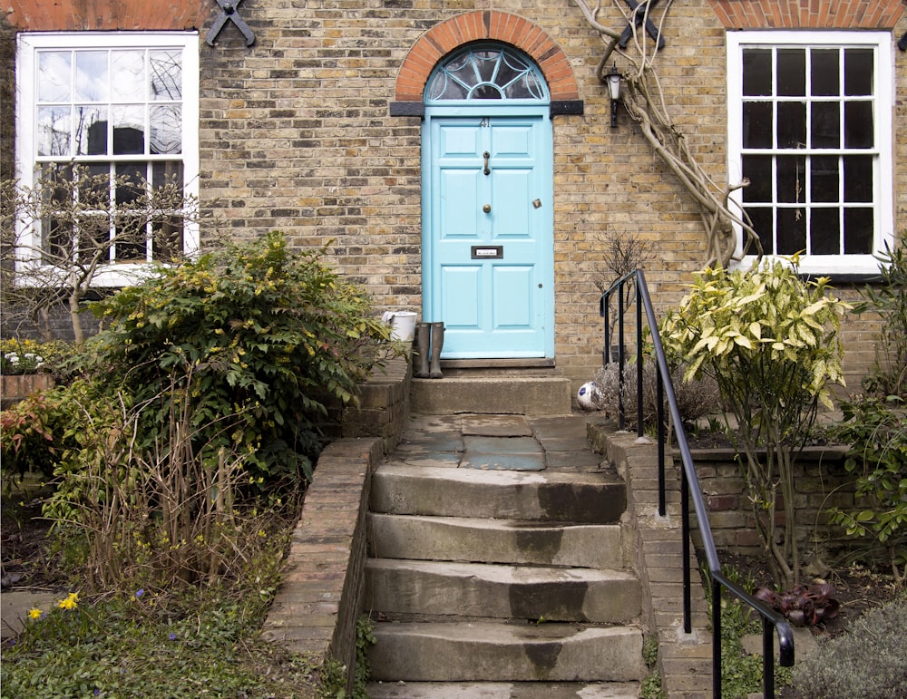 closed teal wooden doors