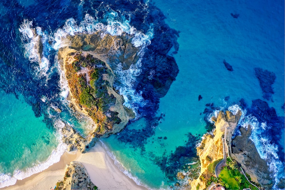 aerial photography of island beside sea