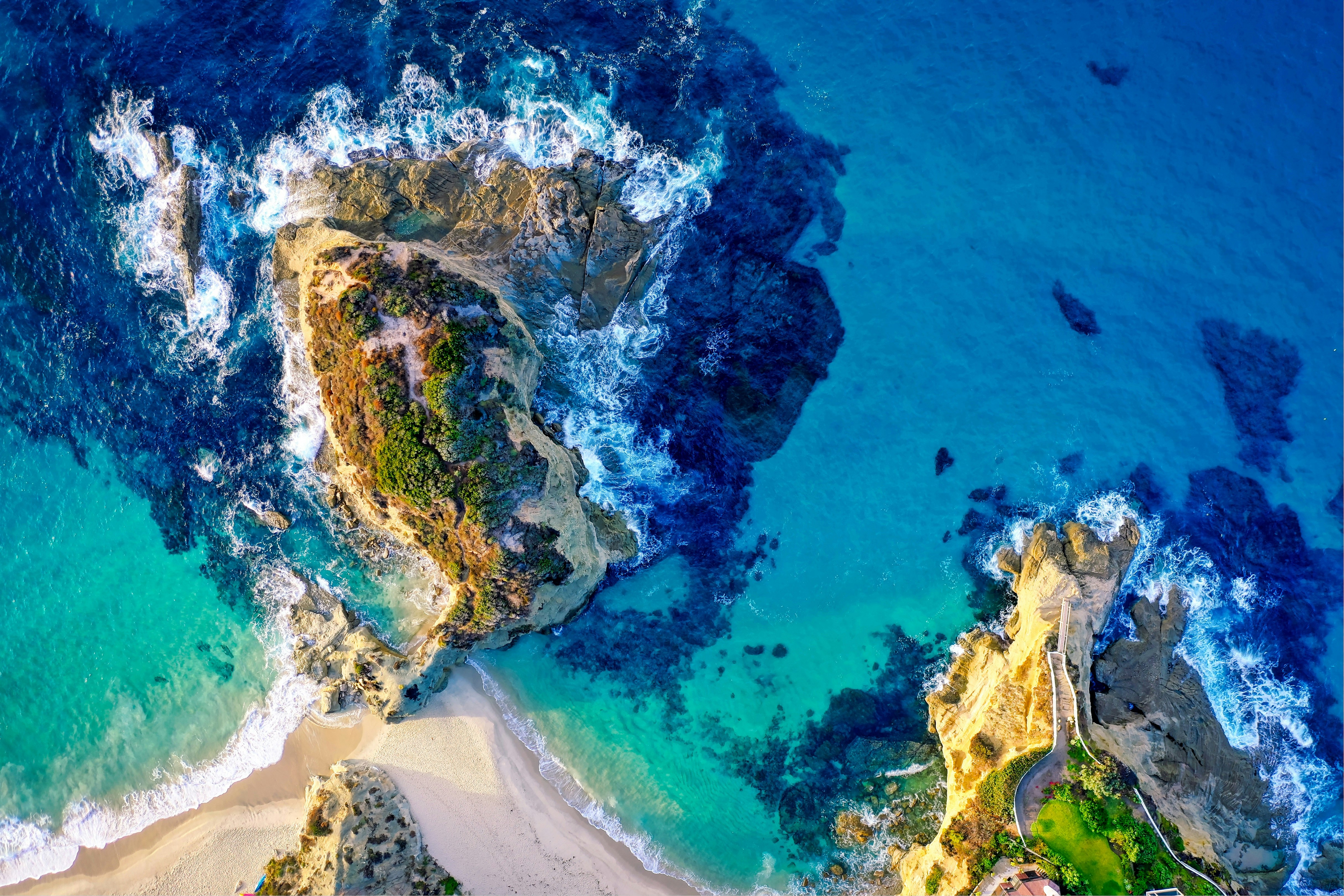 aerial photography of island beside sea