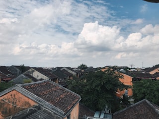 A scenic view of Parsi village showcasing its lush greenery and traditional houses.