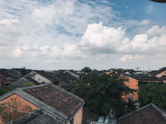 A scenic view of a traditional village landscape with lush greenery.