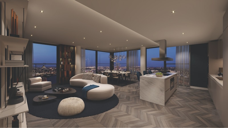 A modern high-rise penthouse living room with floor to ceiling windows and city views, similar to the combined Soho Lofts penthouses now listed downtown