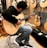 men playing a guitar in a guitar lot room close-up photography
