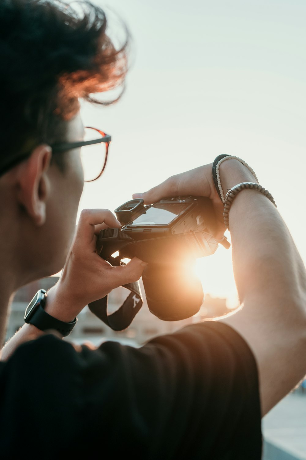 man with grey digital camera