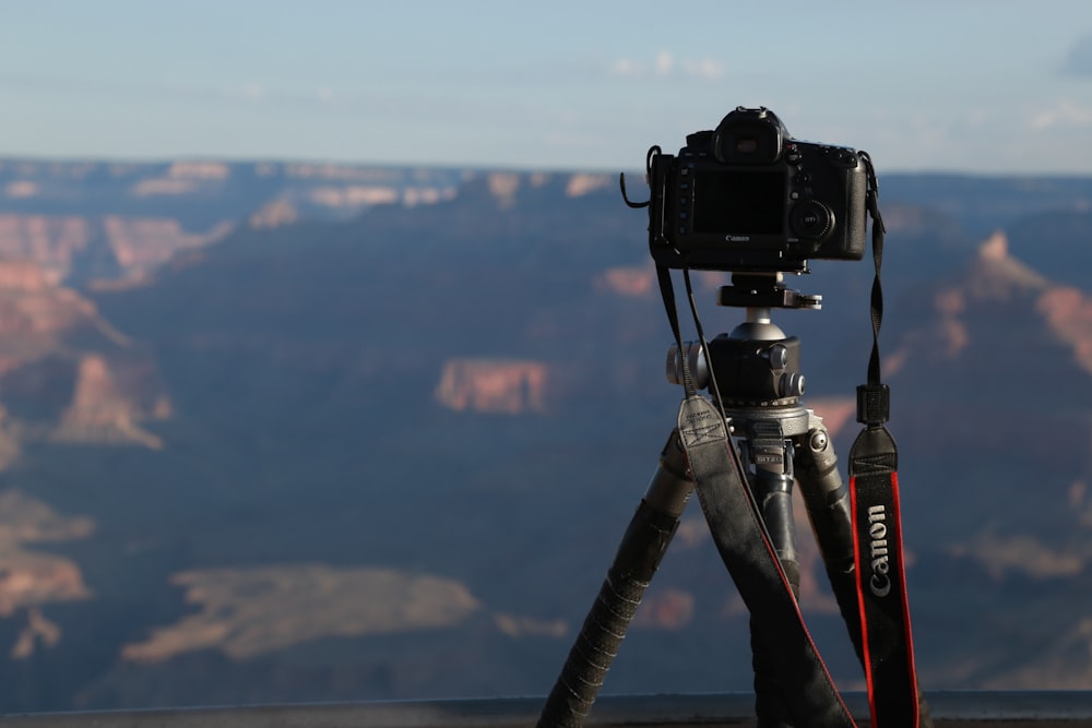 a tripod with a camera on top of it