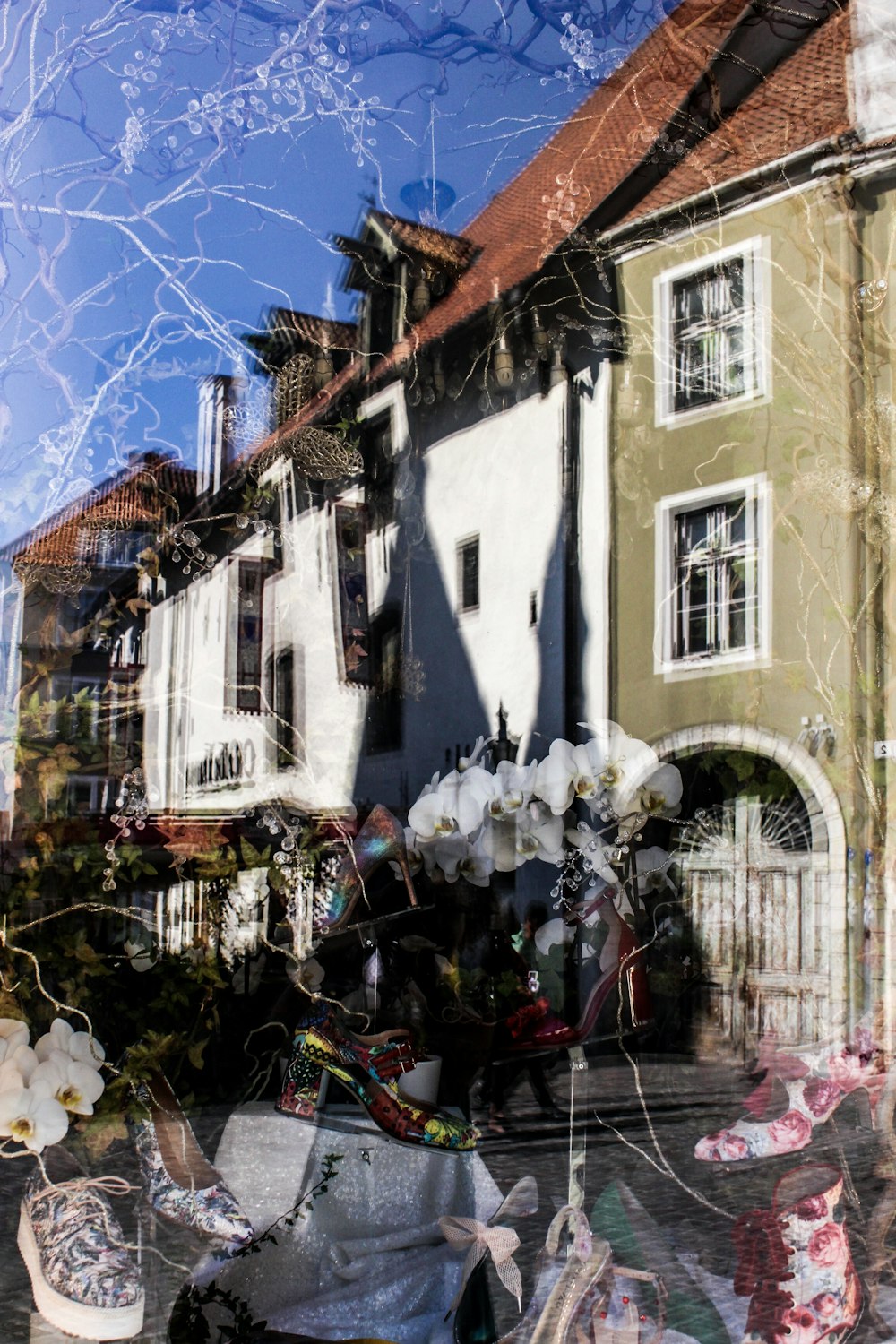 a reflection of a house in a window