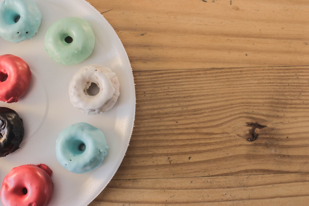 assorted-color donuts on plate