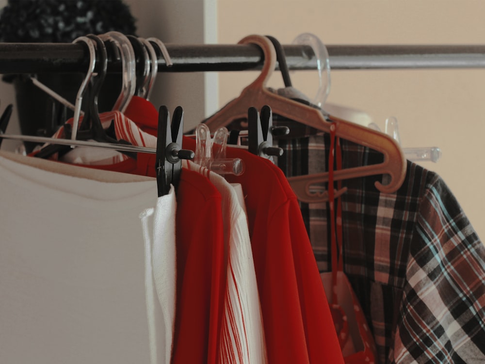 a rack of shirts hanging on a rail