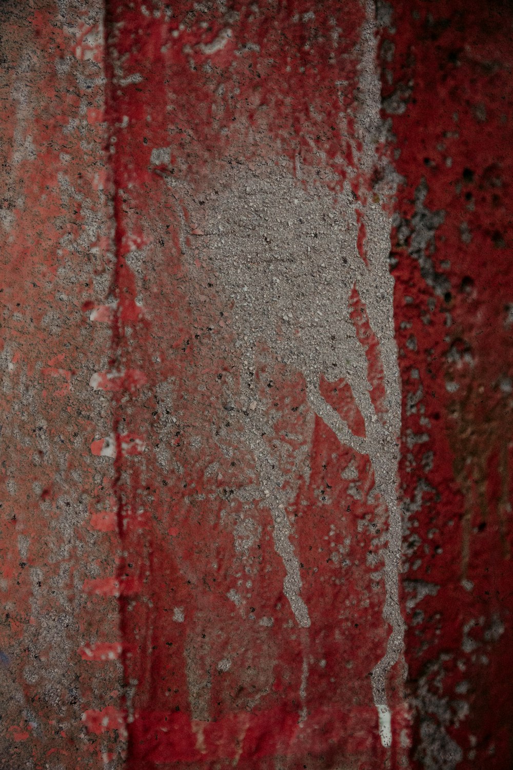 a close up of a red and white wall