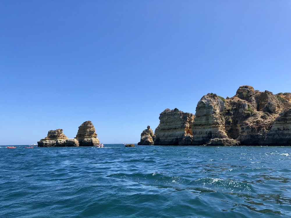 a body of water that has some rocks in it