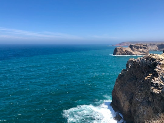 aerial photography of mountain cliff by the sea during daytime in Cabo de Sao Vicente Portugal