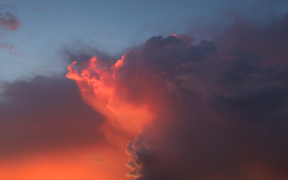 cumulus clouds in the sky during golden hour