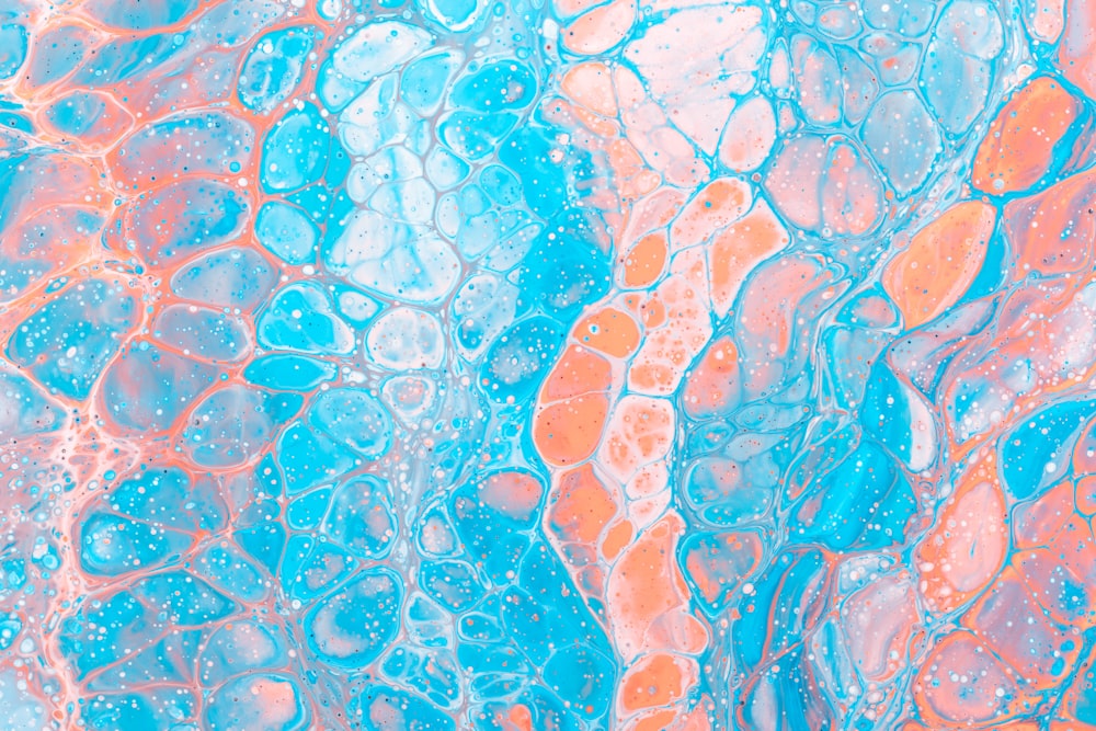 an abstract painting of blue, orange, and pink colors