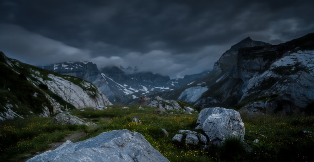 aerial photography of mountains under dramatic sky