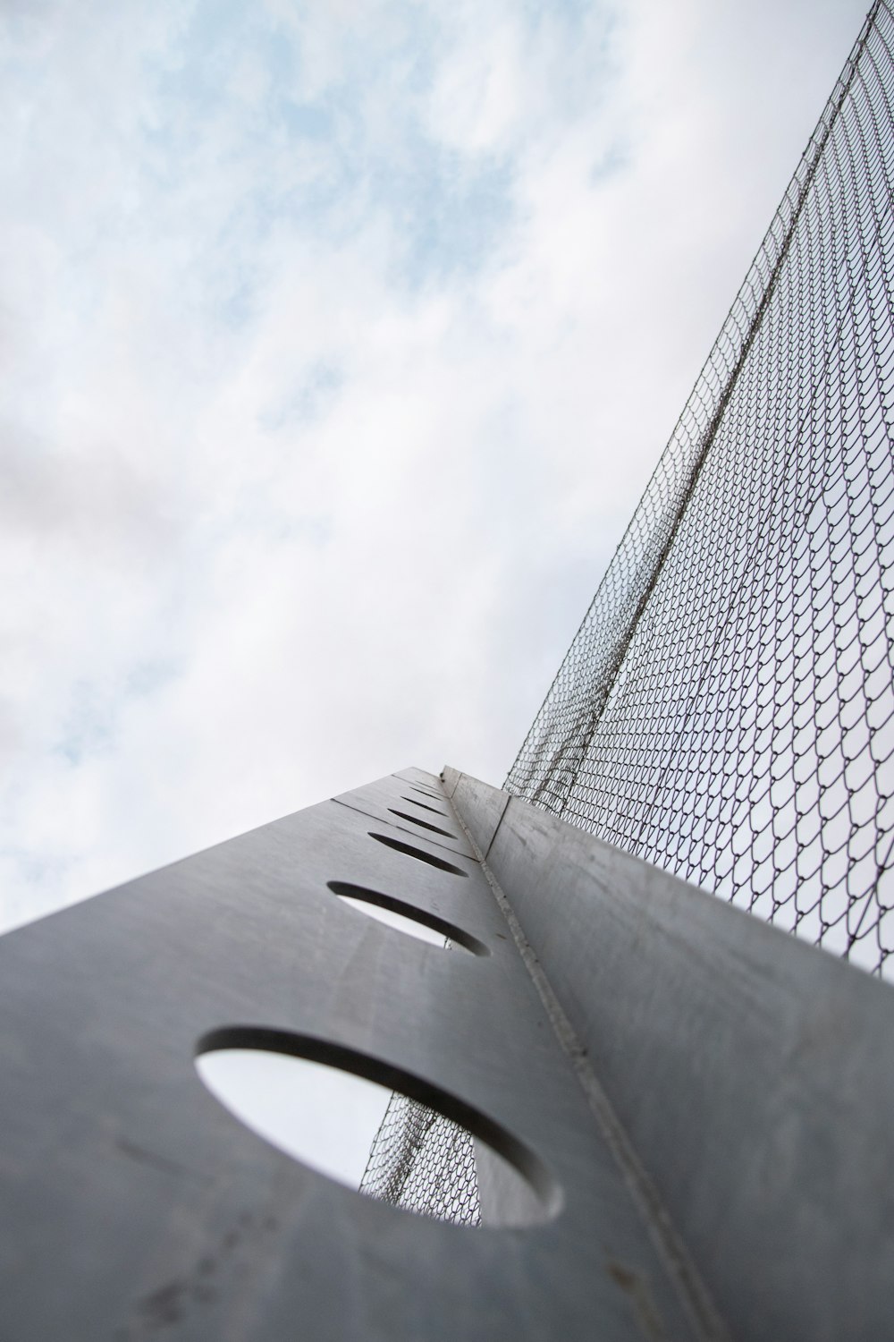 a tall metal structure with a sky in the background