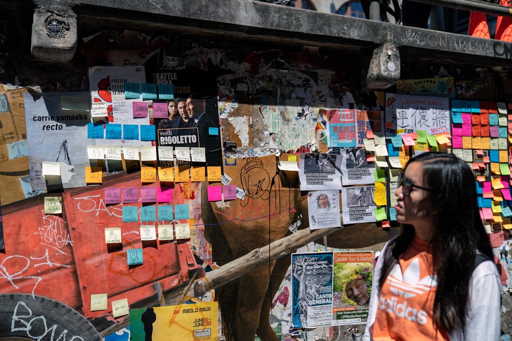 woman looking at wall with sticky notes