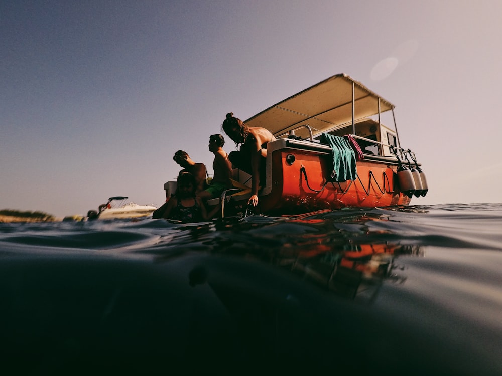 people in boat on sea