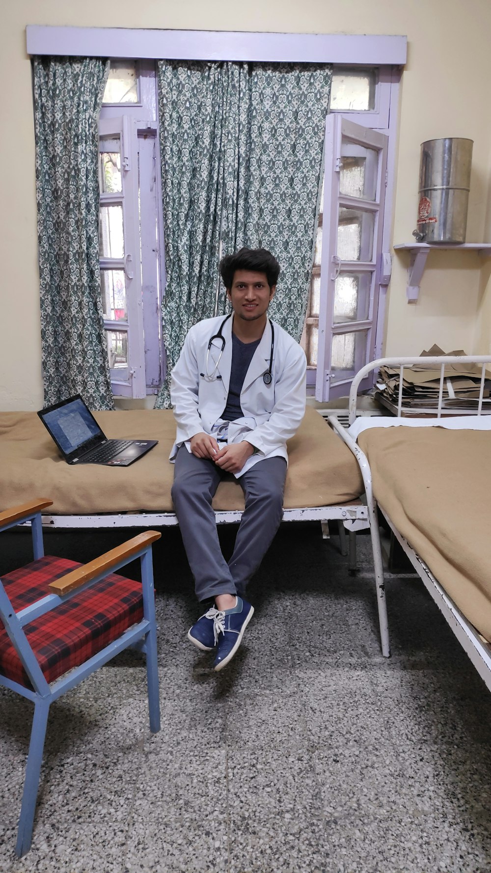 man sitting on hospital bed