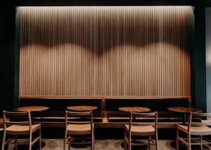 Cozy corner of offpark with warm lighting and inviting seating for gatherings.